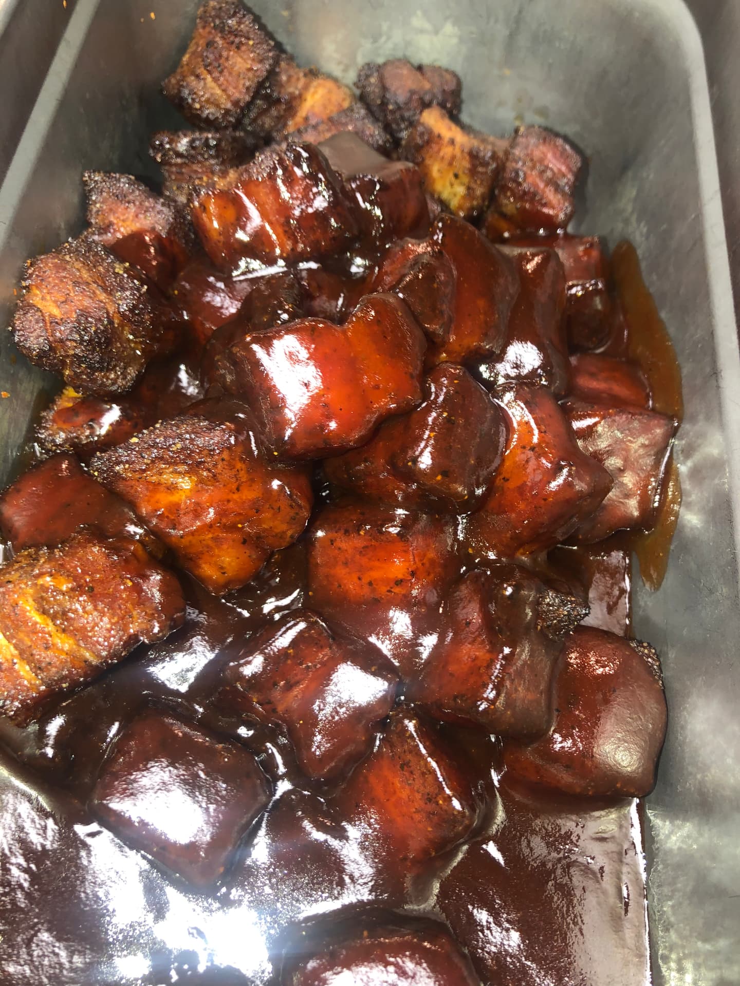 Pork belly burnt ends tossed in barbecue sauce