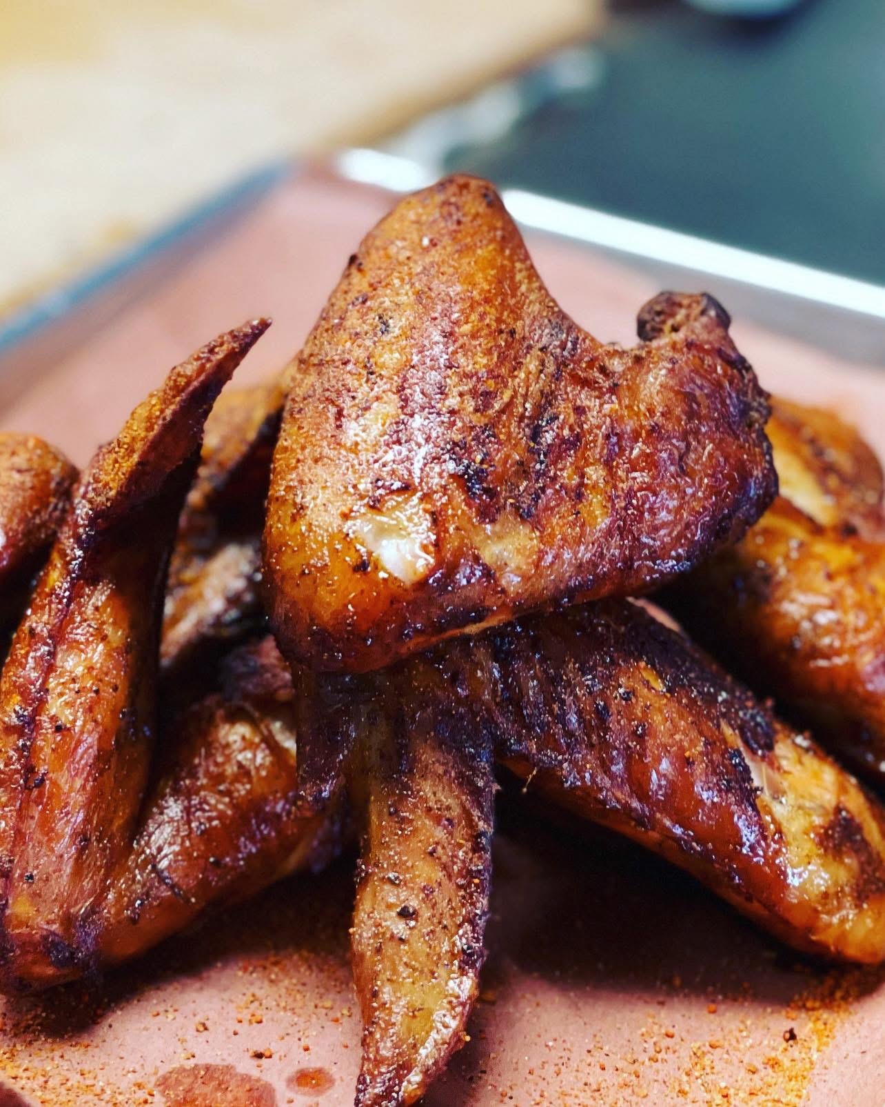 Smoked whole jumbo wings with crisp, seasoned skin