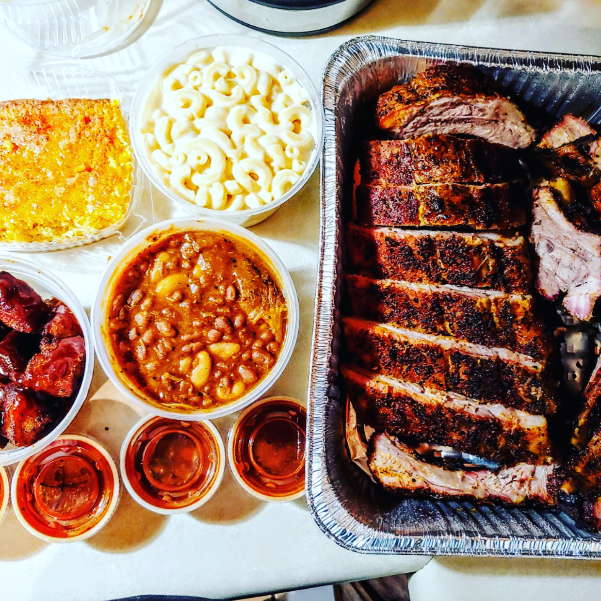 Catered ribs with macaroni and cheese, beans and cornbread