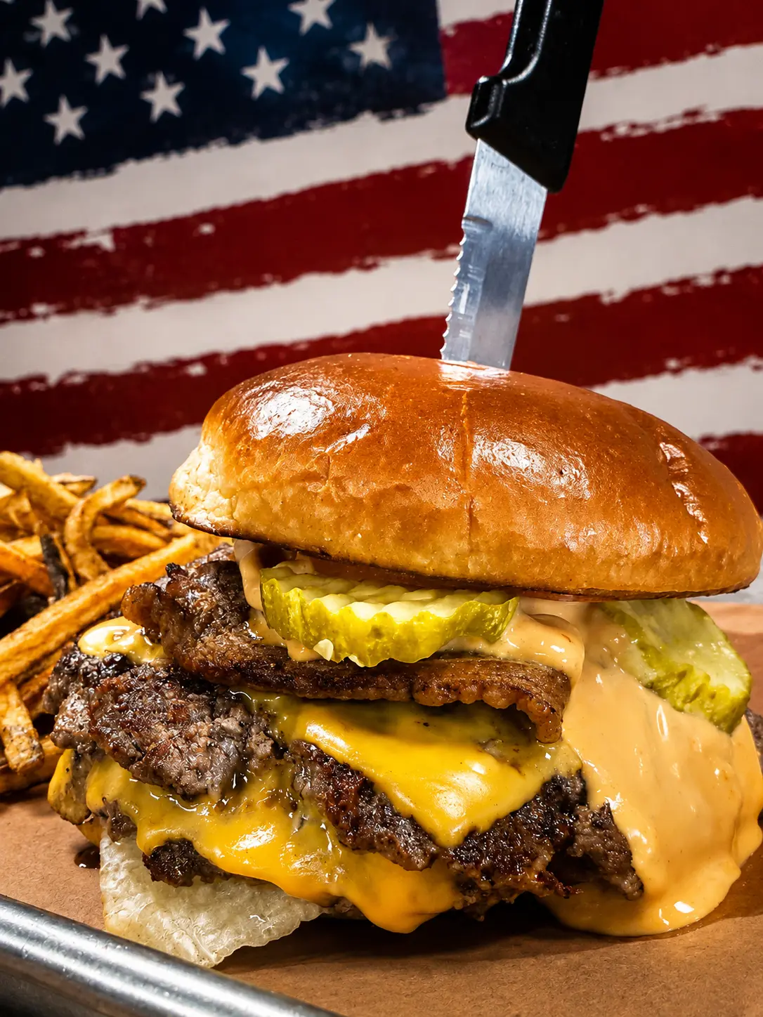 Double smash burger with brisket, pickles and house sauce
