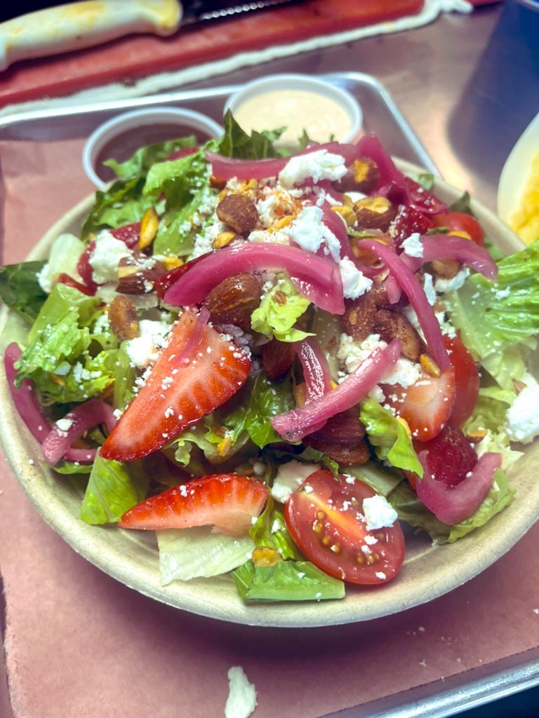 Seasonal salad with strawberries and pickled onions